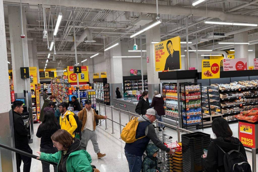 Shoppers check out the No Frills store that opened its doors on Thursday, Dec. 11 in the former home of the Victoria Public Market at 1701 Douglas St. (Tony Trozzo/Victoria News)