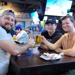 (L‑R) Jonathan, Blake and Alex enjoy a few beers as they get ready to watch this year&rsquo;s Super Bowl, pitting the Seattle Seahawks against the New England Patriots. (Olivier Laurin/Saanich News)