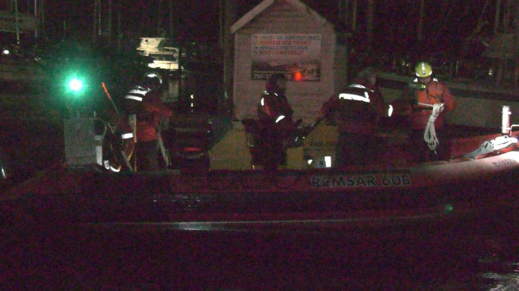 The paddler was cold but appeared to be in good spirits as he walked with volunteers from the rescue boat towards an awaiting ambulance that transported him to hospital. (Gord Kurbis)